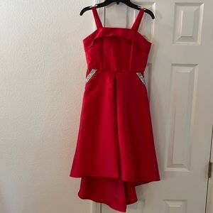 Girls hi-low red dress, with gem pocket details